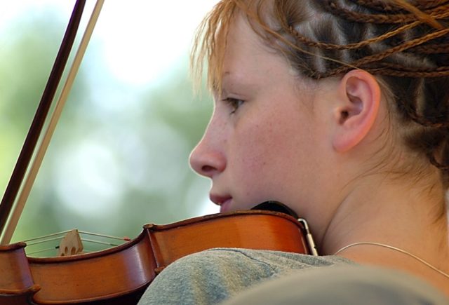 Girl playing a fiddle