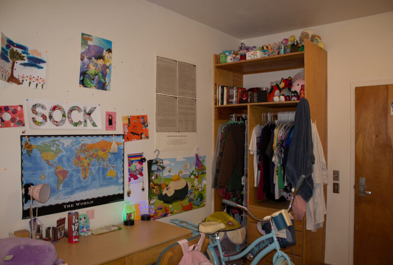 A dorm room in ANTC. A desk and wardrobe are in the shot. Everything is neatly placed.