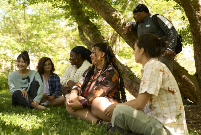 Students on the Wilson Inclusion, Diversity, and Equity, or WIDE, crew sit outside for their meeting.